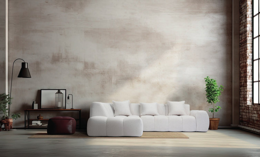 Canapé d'angle Bubble en tissu bouclé blanc cassé, coussins capitonnés en bulles, dans un loft