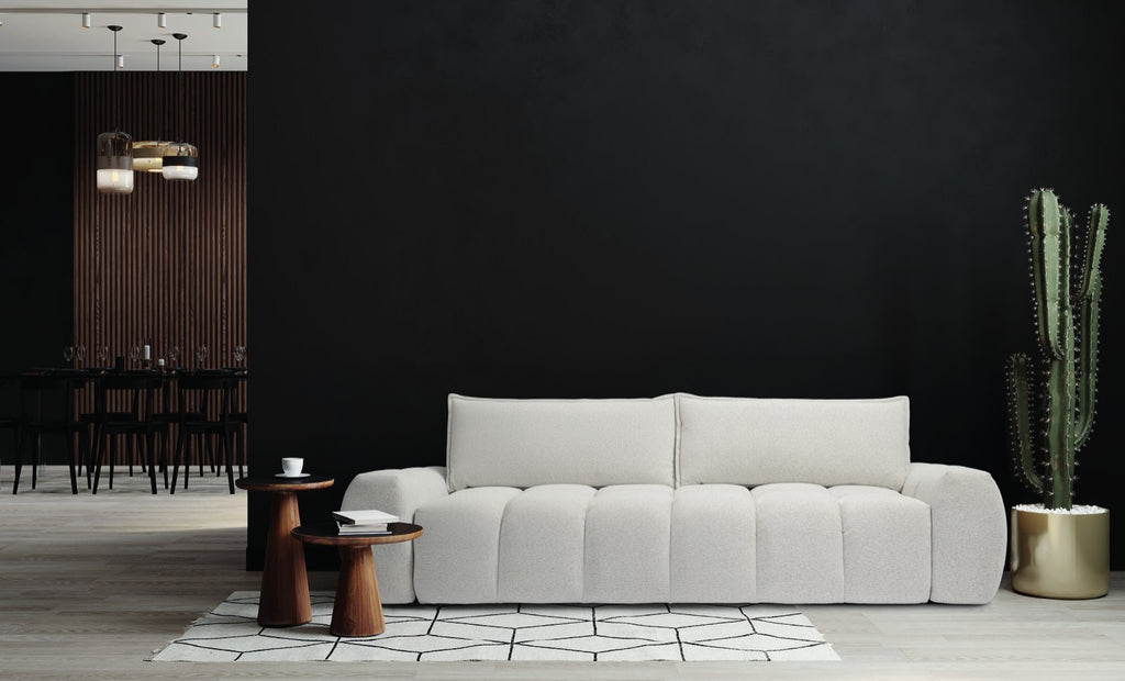 Canapé droit Bubble Function en tissu bouclé gris clair, assise matelassée, devant un mur noir